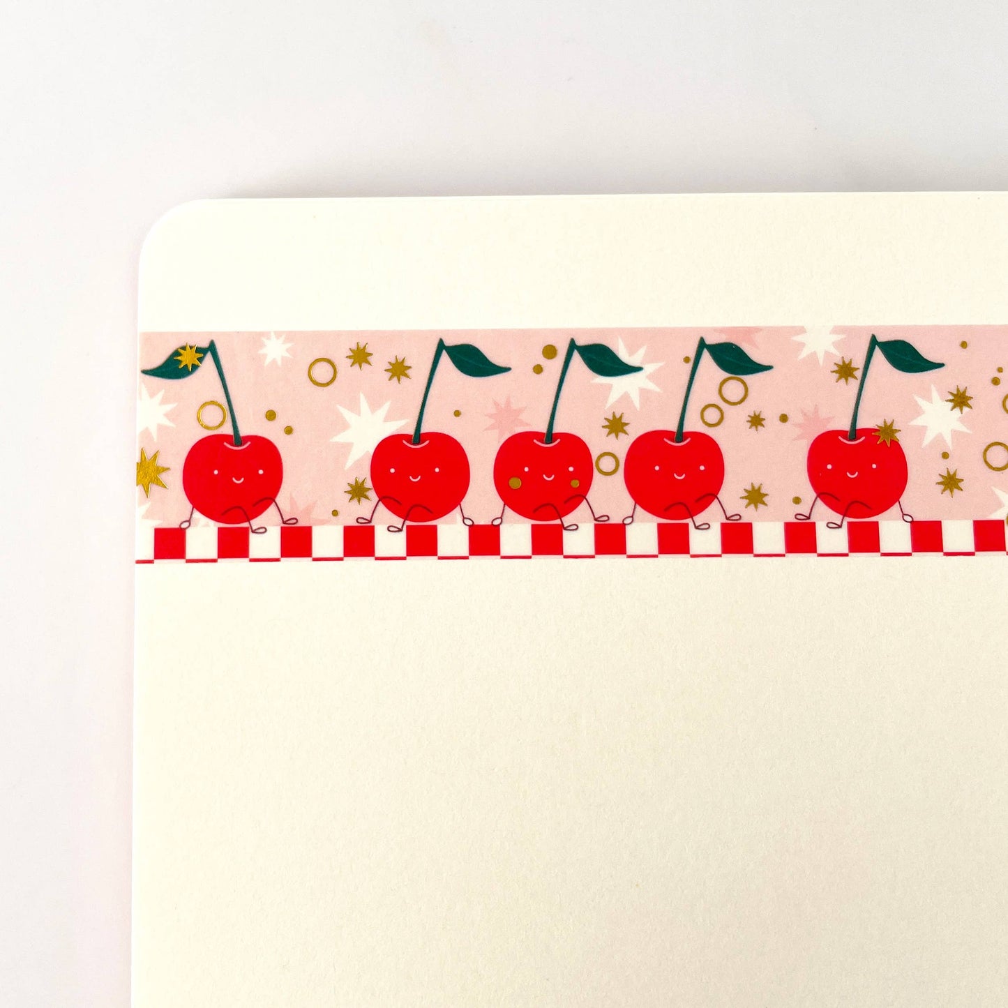 pink washi tape with gold foil accents and red cherries on it