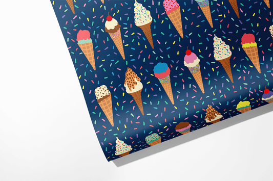 Wrapping paper roll -- dark blue background with colorful confetti sprinkles on it along with rows of various ice cream cones 