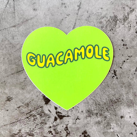 Lime green, heart-shaped sticker with "Guacamole" printed in bright yellow bubble letter font.