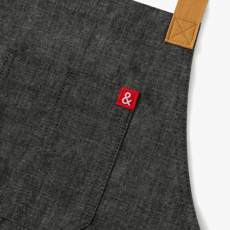 Close up apron to show ampersand logo of the company.