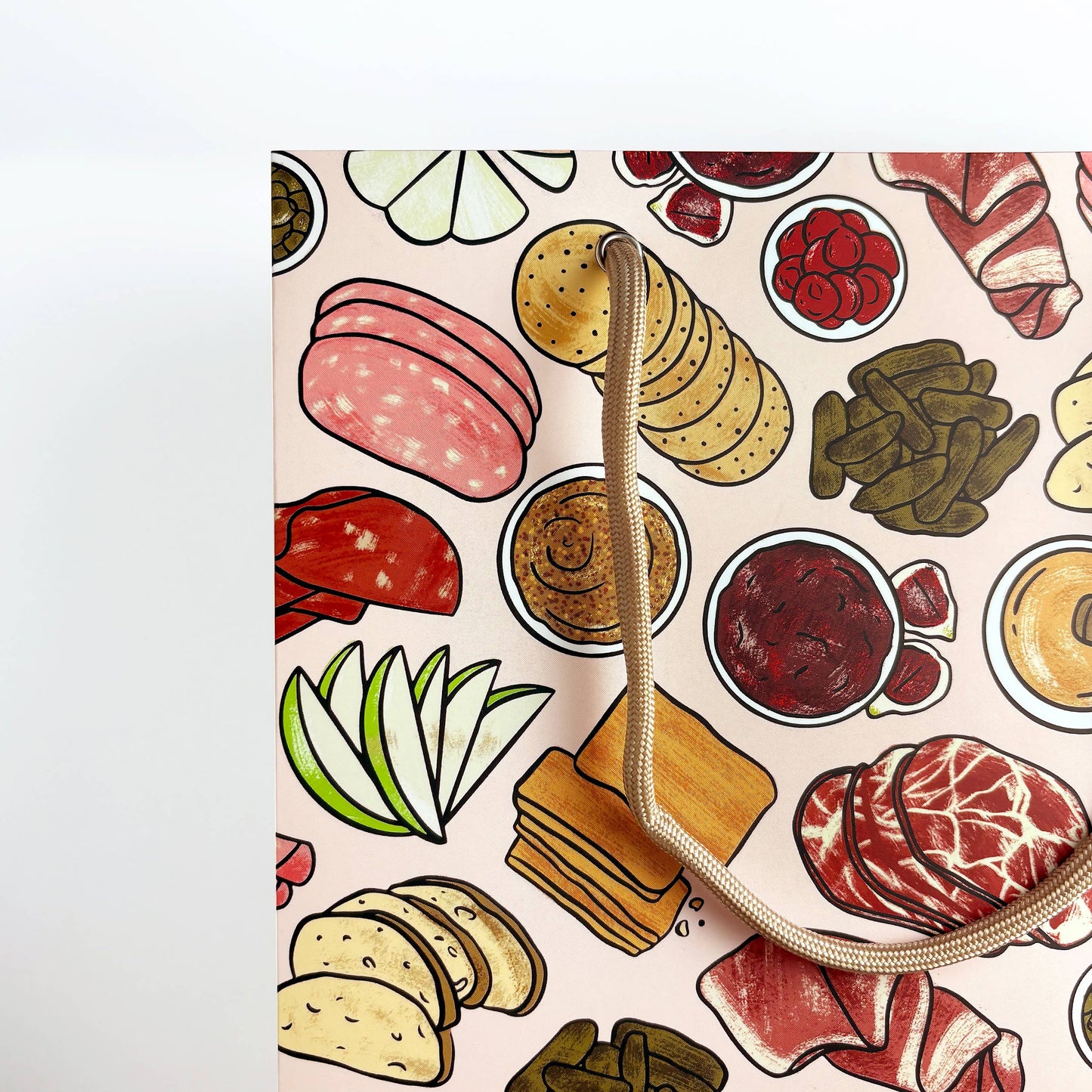 Patterned bag with illustrations of meats, bread, and condiments on a light pink background
