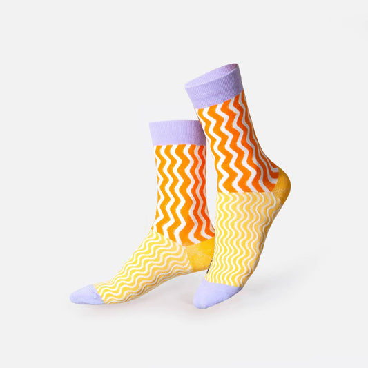 Colorful zigzag patterned socks on a white background