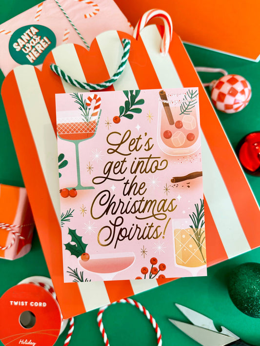 Christmas-themed gift and card with festive design on a colorful background