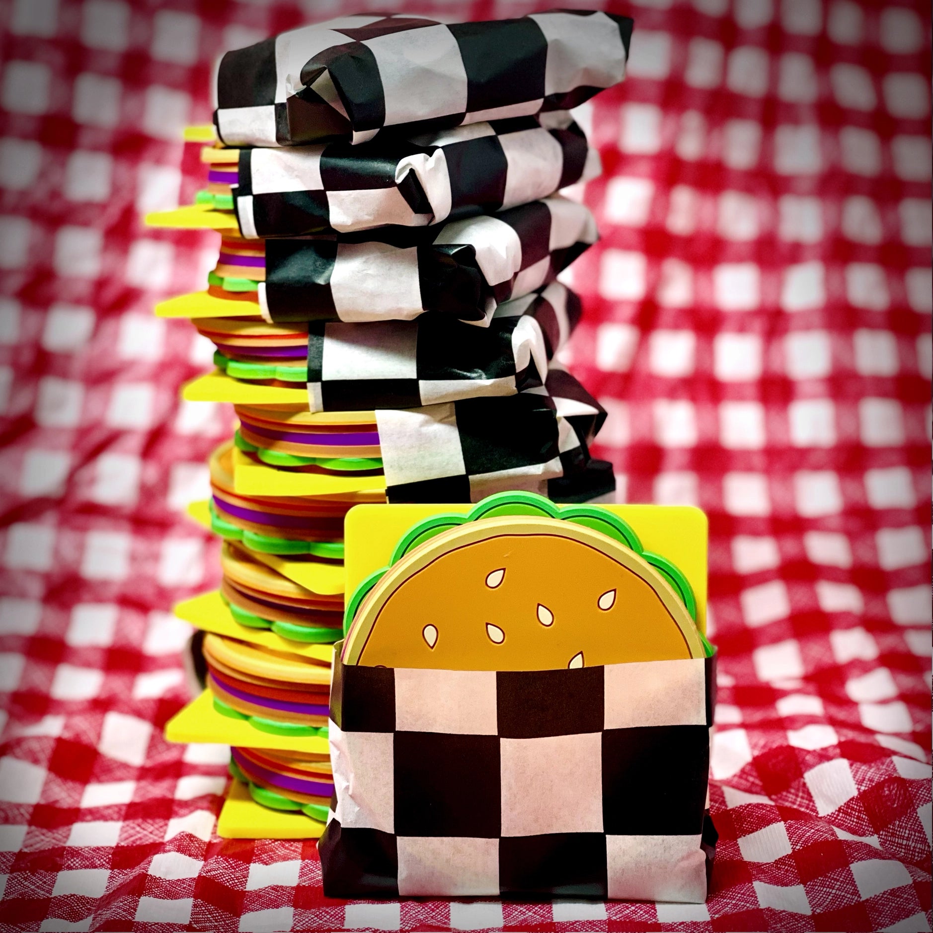 Cheeseburger coaster set in black and white grease paper.