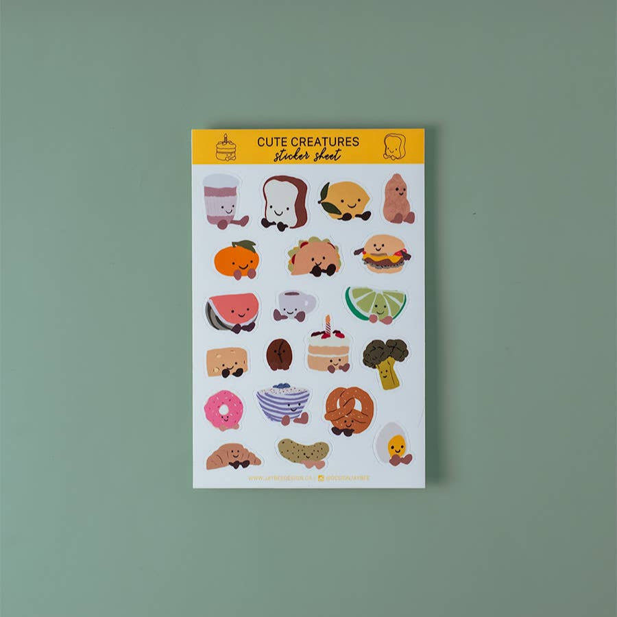 Sticker sheet with 20 cute food-themed stickers (each illustrated with little smiley face and little cartoon feet) on a white background. Foods include toast, taco, watermelon, cheese, coffee, peanut, cake, pickle, croissant, boiled egg... and more!