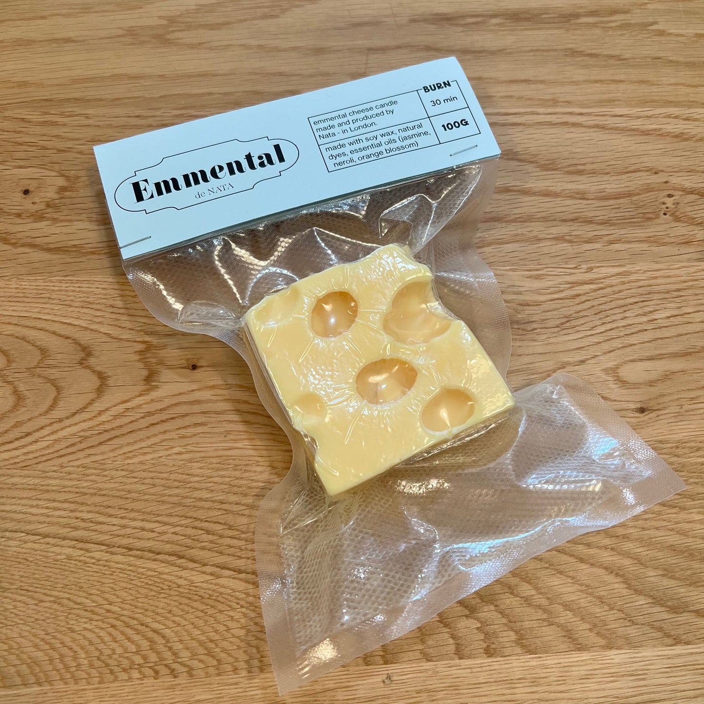 Emmental candle in a food seal bag with blue label.