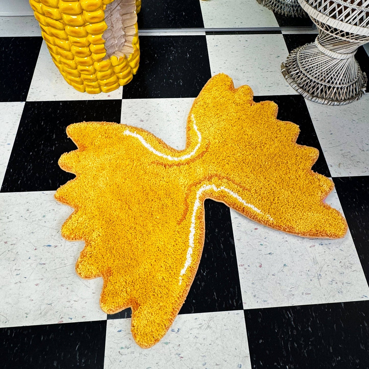 Farfalle rug on checkerboard floor