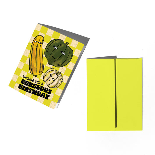 Greeting card with pumpkins and checkered design on a white background
