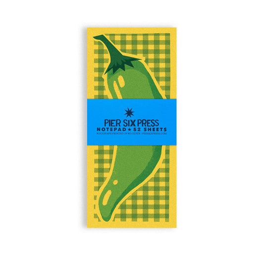 Notepad with green chili design on yellow and green checker background