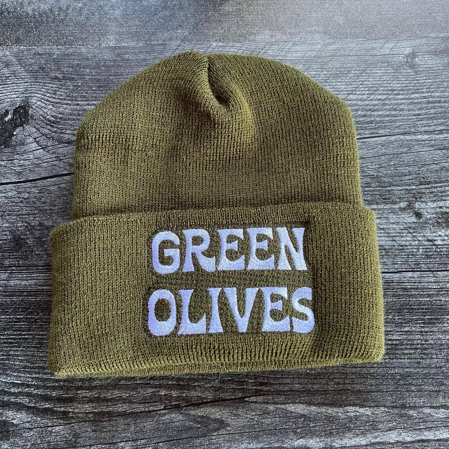 olive green beanie with white embroidered text that reads "Green Olives"