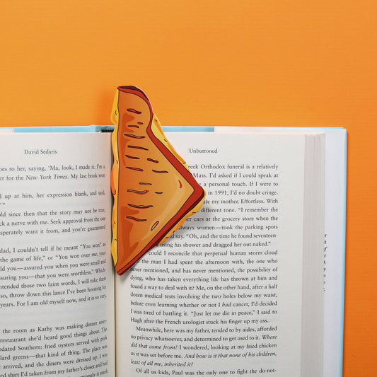 bookmark that looks like a triangle shaped half of a grilled cheese sandwich inside a book