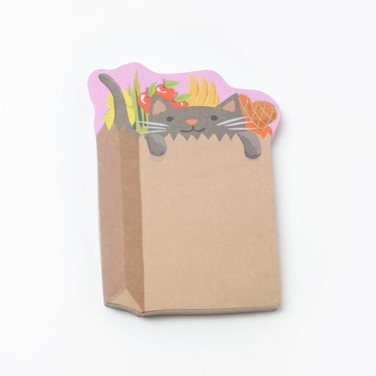 Stack of sticky notes with design of a cat inside a grocery bag