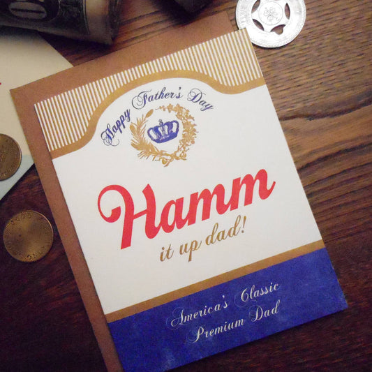 Father's Day card with Hamm beer branding on a wooden surface