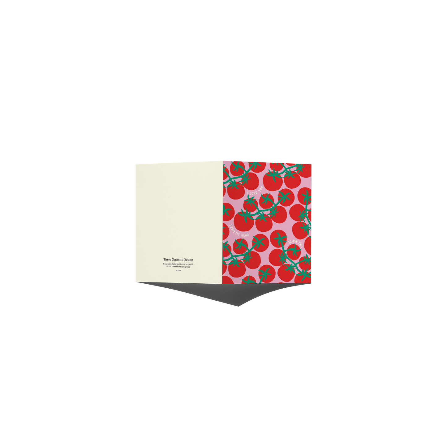 A folded greeting card shown open against a plain white background. The left panel is a warm cream color with small black text, and the right panel features a repeating pattern of red tomatoes with green stems on a light pink background.