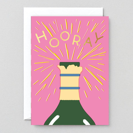 Greeting card with a bottle of champagne and 'HOORAY' text on a pink background