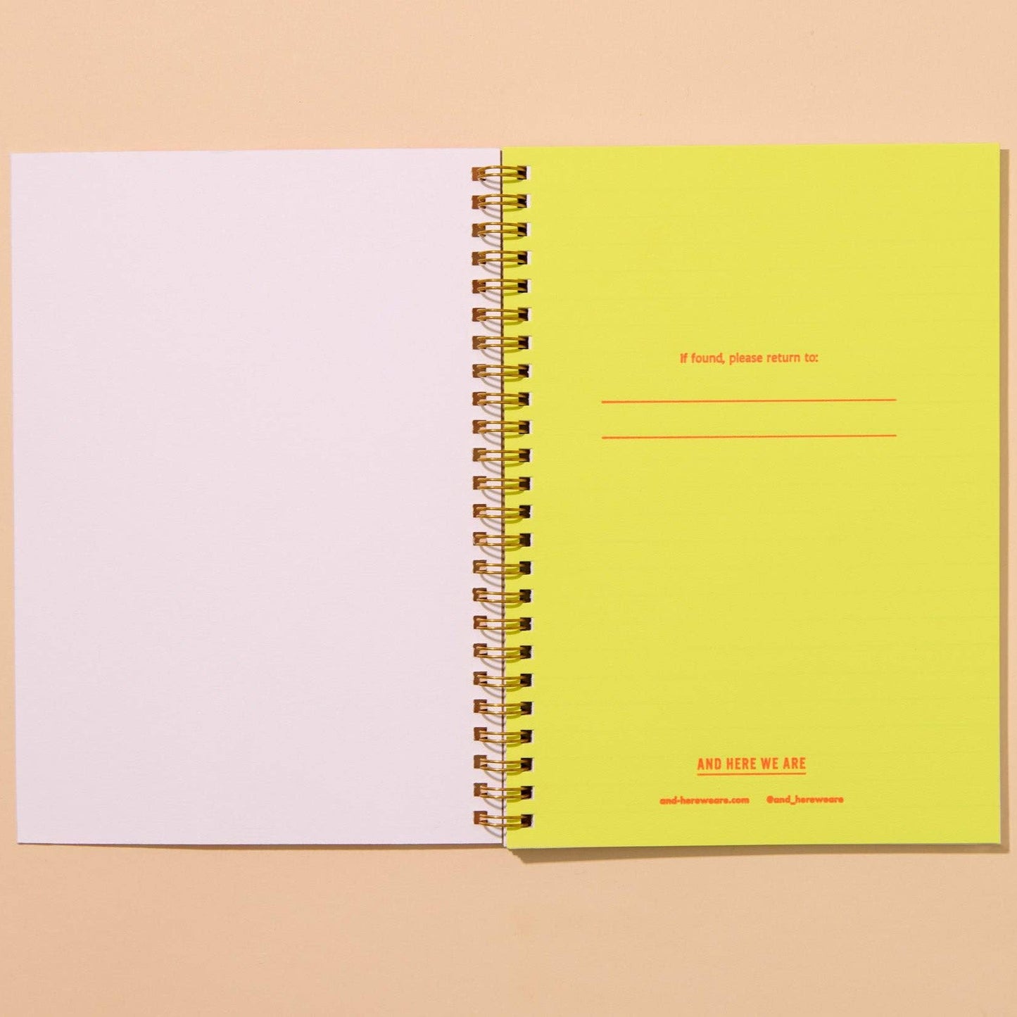 Notebook is open to reveal the inside page which has lines to fill out: If found, please return to: