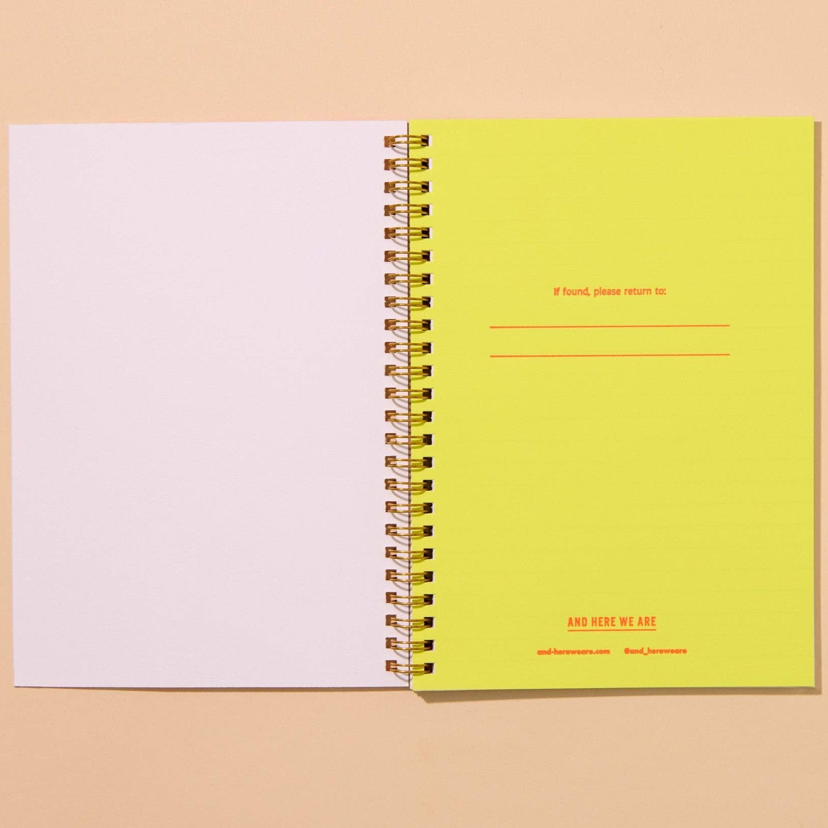 Notebook is open to reveal the inside page which has lines to fill out: If found, please return to: