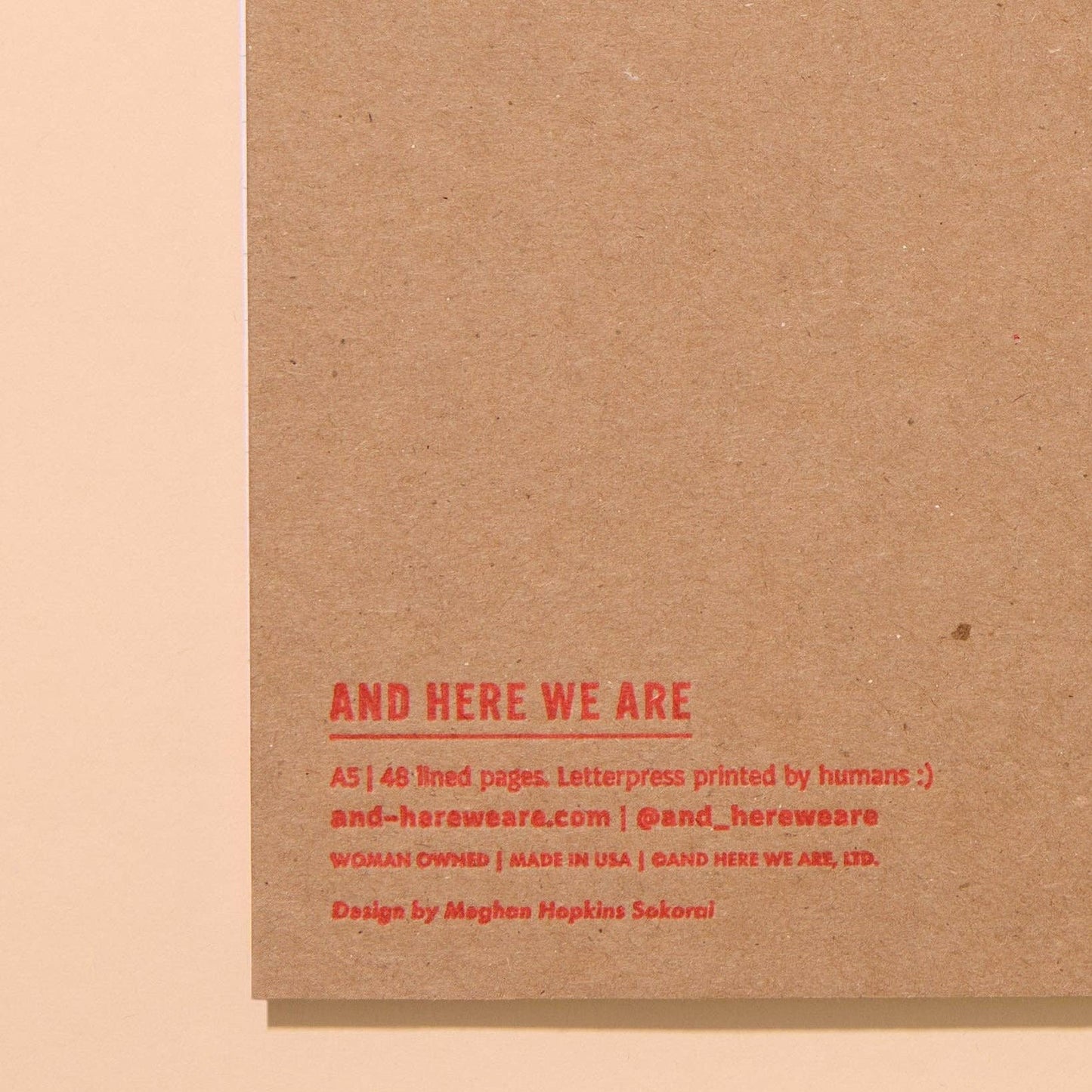Back of notebook to show logo: And Here We Are