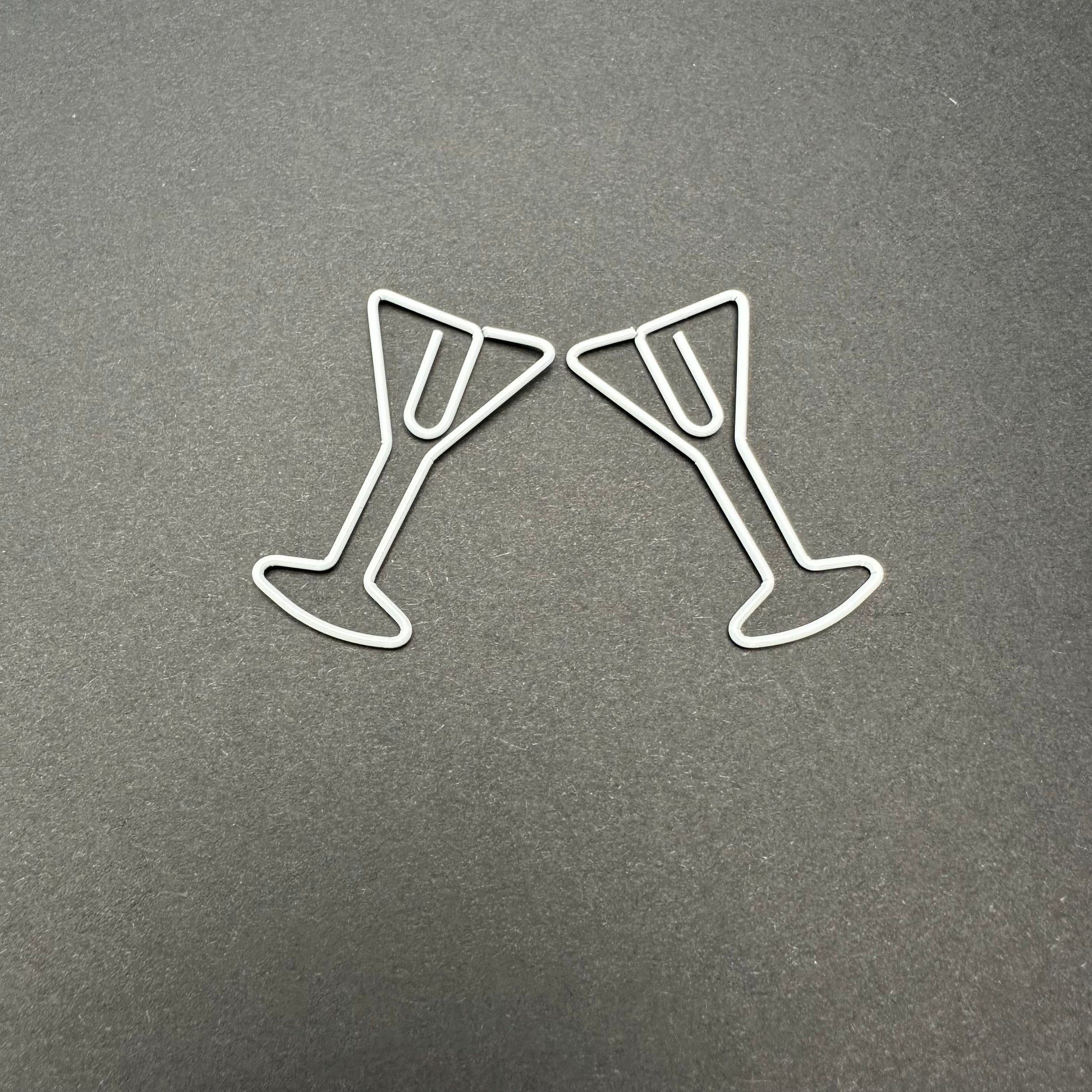 Two white martini paperclips.