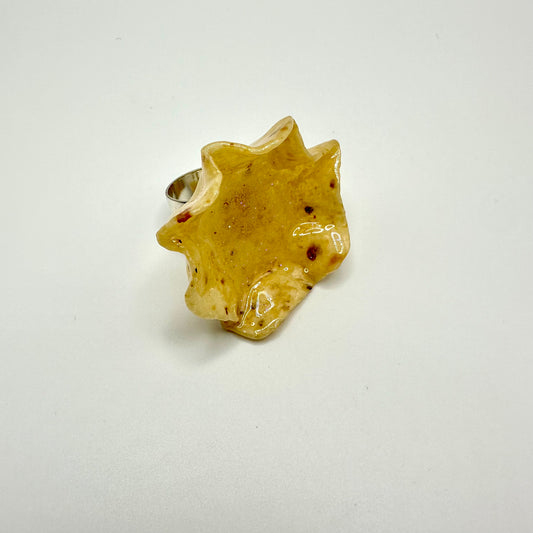 Tostito chip ring. Tostito is dipped in resin.