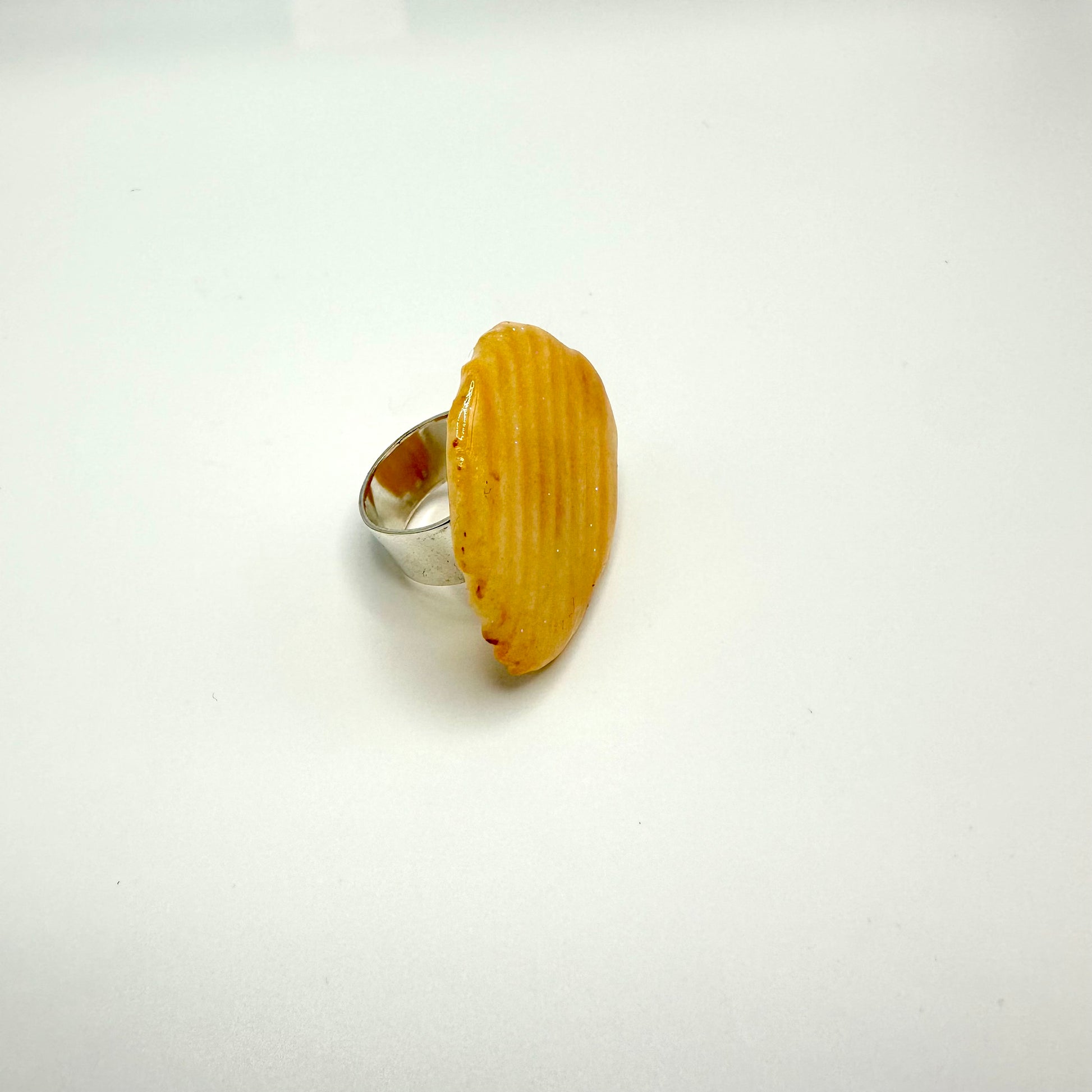 Ruffle chip ring dipped in resin.