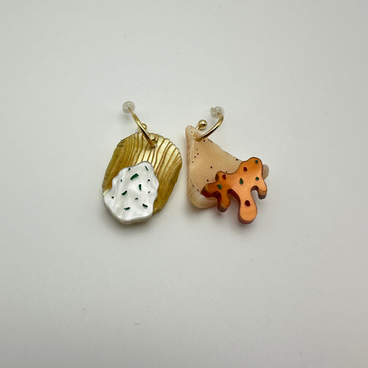 Chip and Dip mismatched earring set. One is a ruffle with a sourcream and chive dip, and the other is a tortilla chip with nacho cheese sauce. Gold hoops.  By Machbecks.