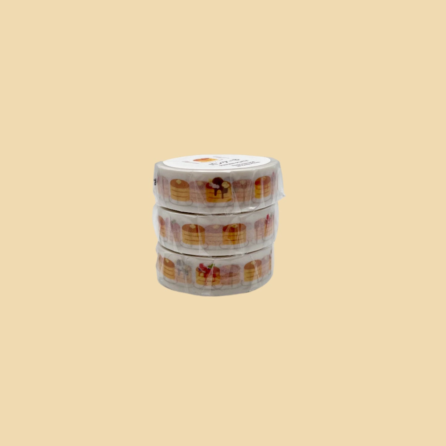 Washi tape featuring a stack of pancakes with a fork and knife. Some pancakes have topping such as strawberries and bananas.