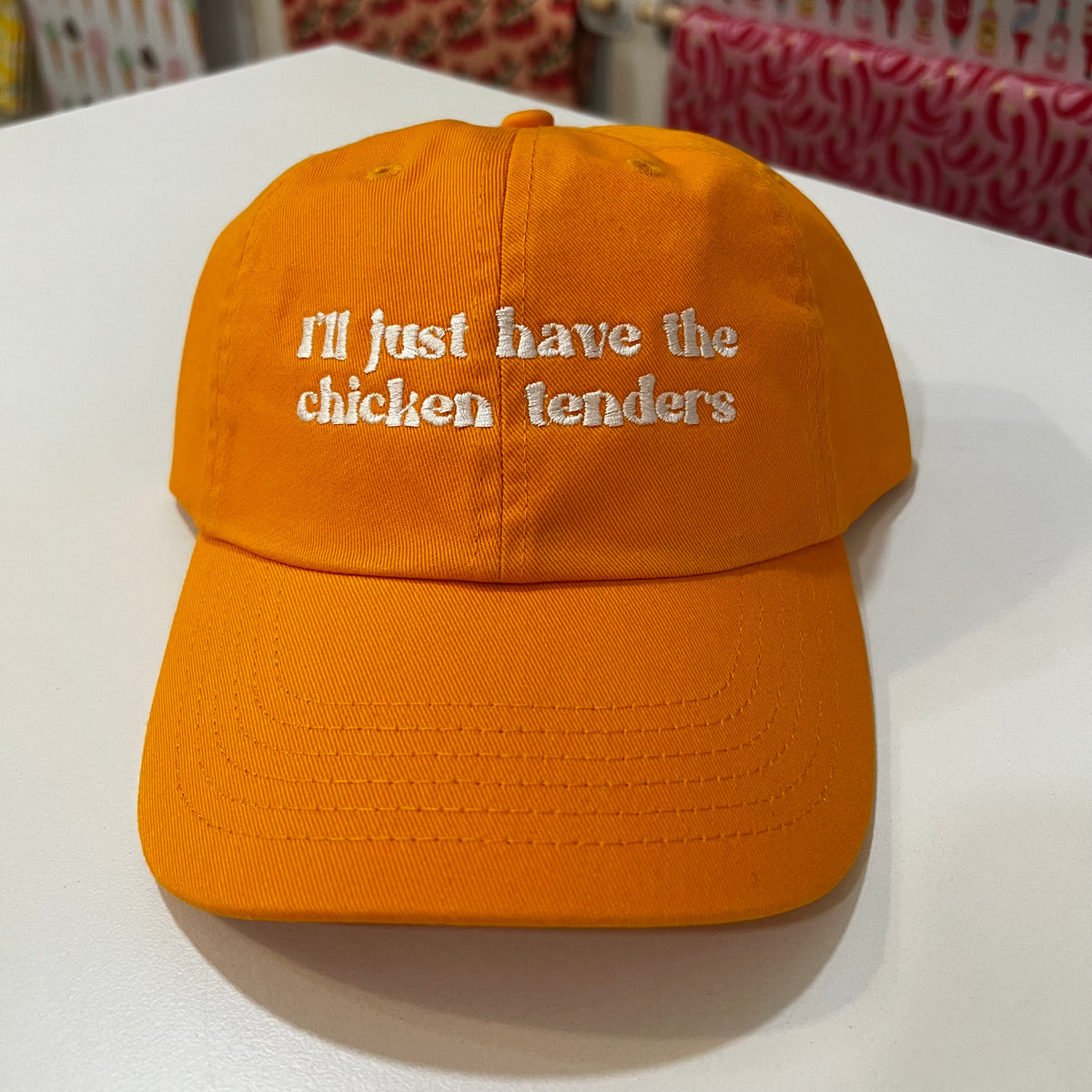 I'll just have the chicken tenders hat. Golden color with white text.