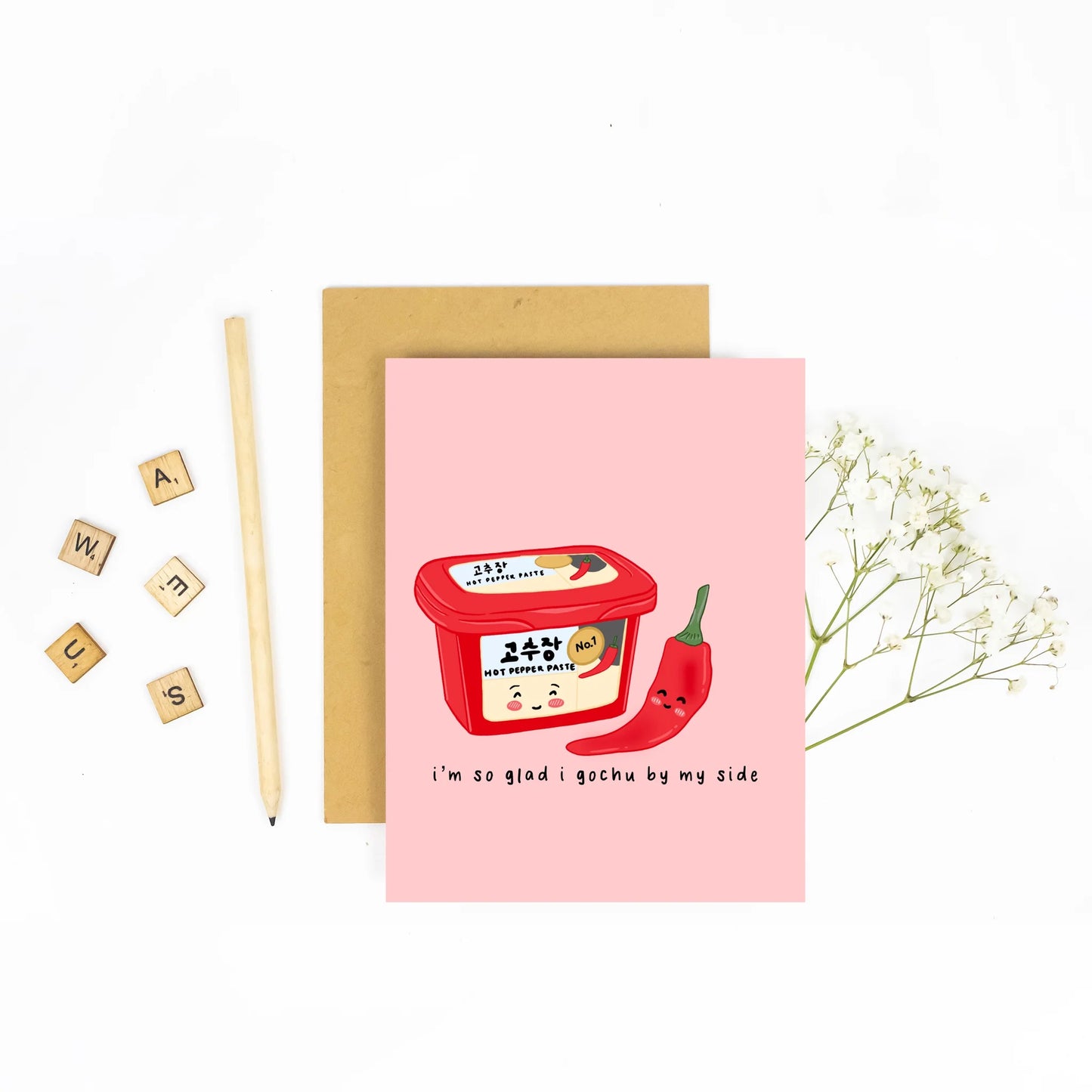 Pink card with korean chili paste on the front. Words say "i'm so glad I gochu by my side"