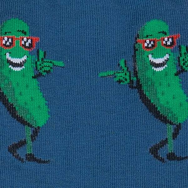 Close up of sock pattern - anthropomorphic pickle in red sunglasses, grinning and snapping his fingers like the cool guy he is.