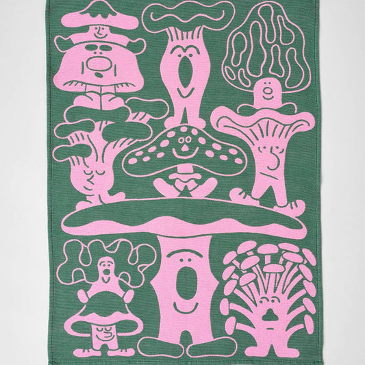 Green towel with pink mushroom and toadstool designs on a white background