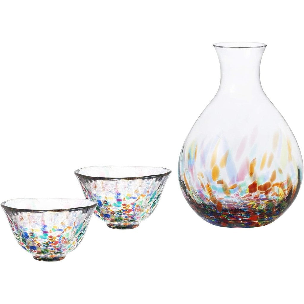 Set of three colorful glass pieces including a sake carafe and two sake cups on a white background