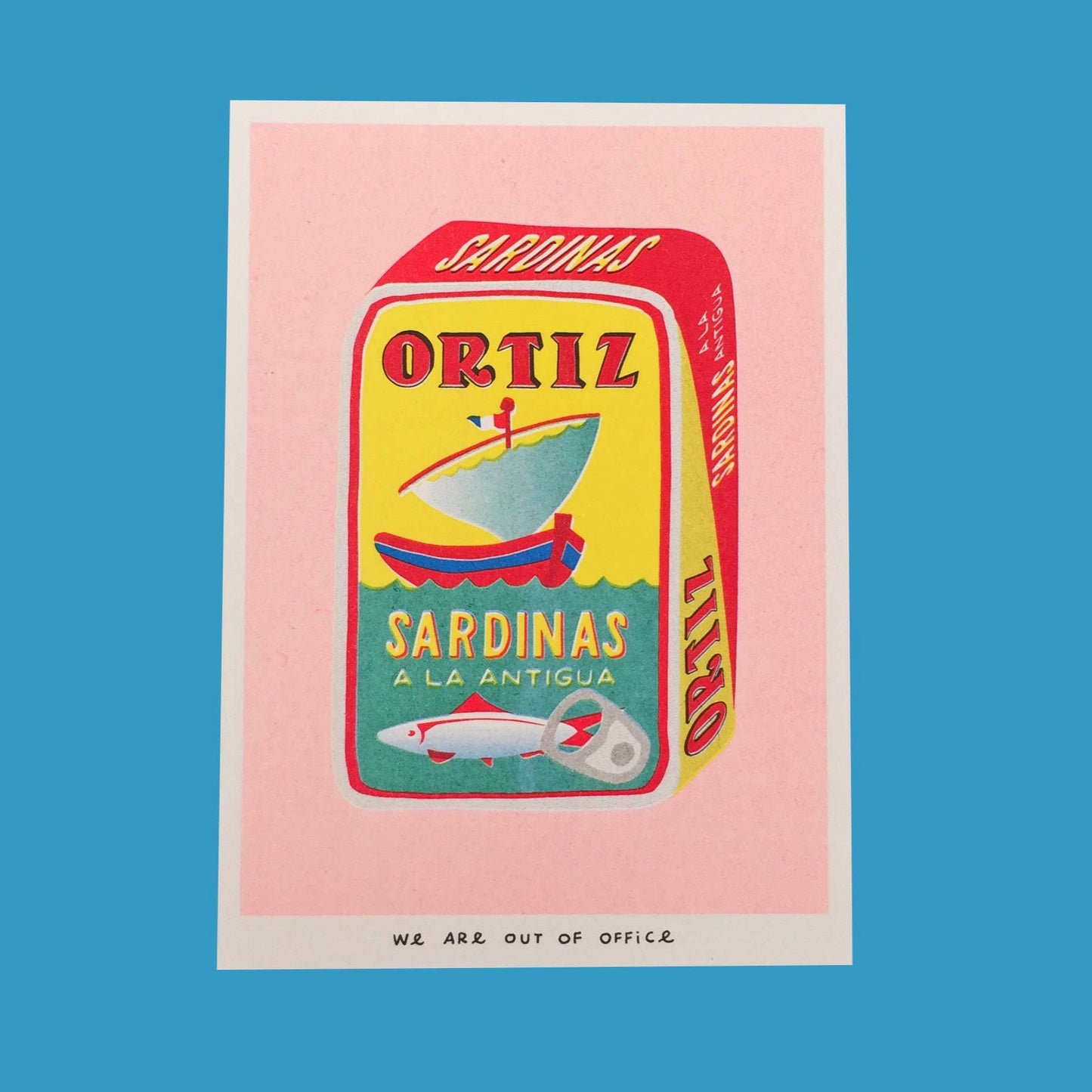 Vintage-style sardine can label with 'Ortiz' branding on a pink and blue background
