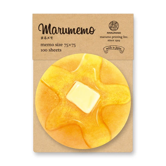Memo pad that looks like a pancake with a melted pad of butter and syrup on it.