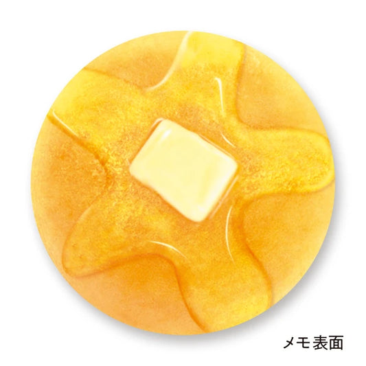 Memo pad that looks like a pancake with a melted pad of butter and syrup on it.