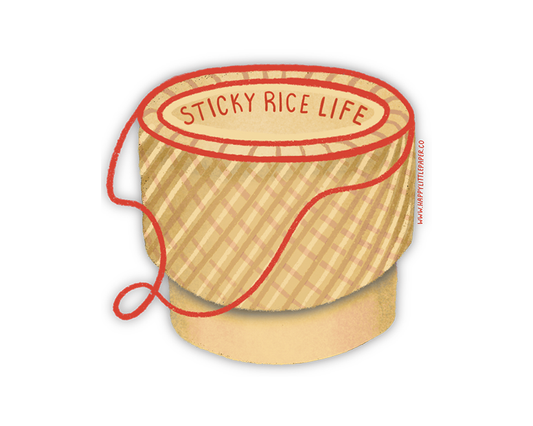 Wooden steamer with red string labeled 'Sticky Rice Life' on a white background