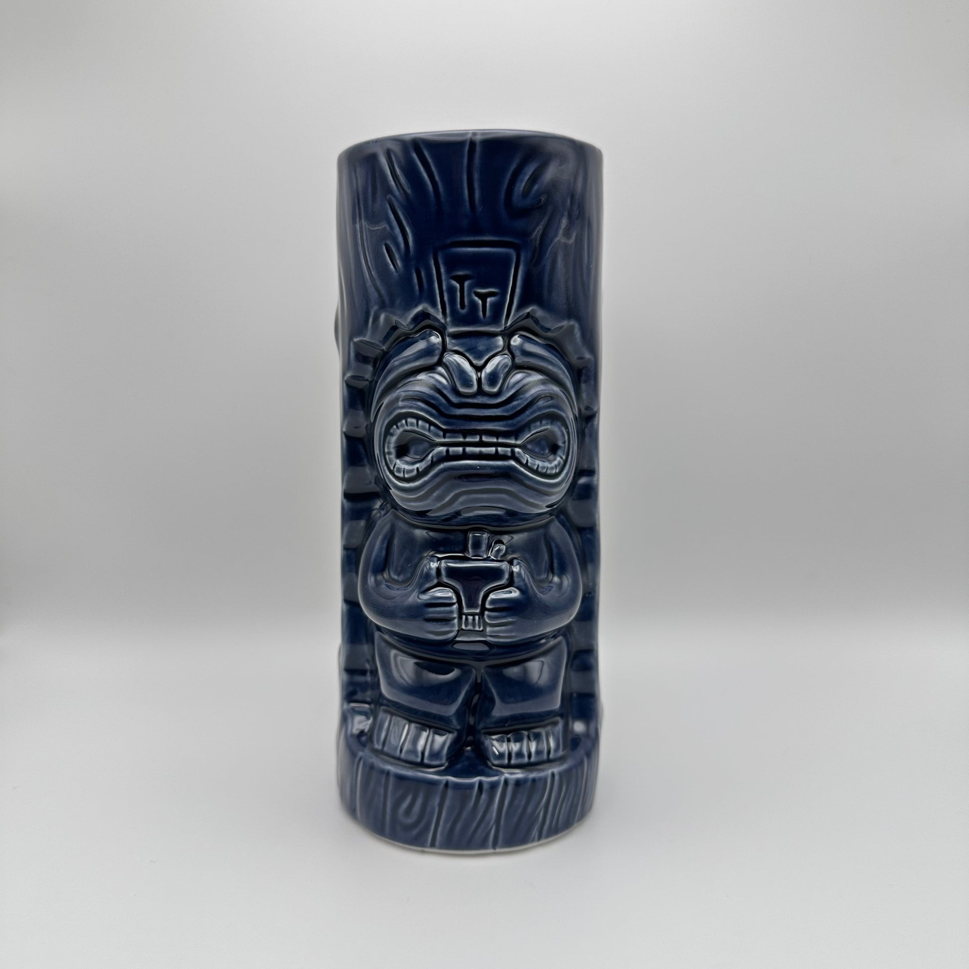 Tiki mug with a dark blue finish on a white background