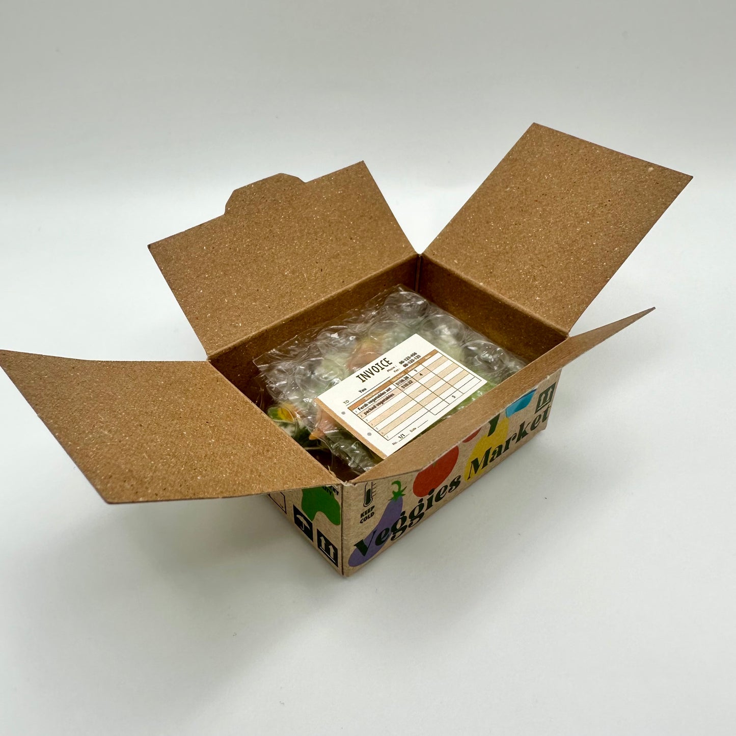 Open Veggie Box with little sticker inside that looks like an invoice.