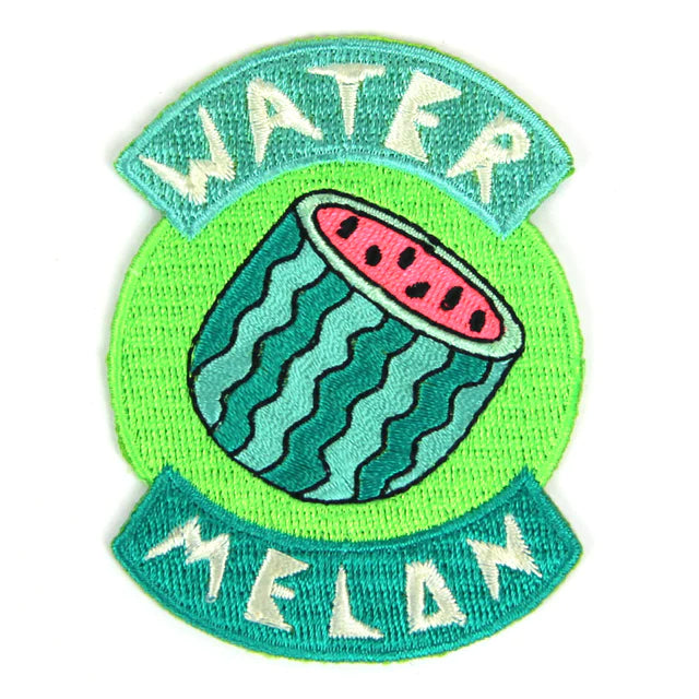 Watermelon patch with the words and a watermelon cut in half exposing seeds.