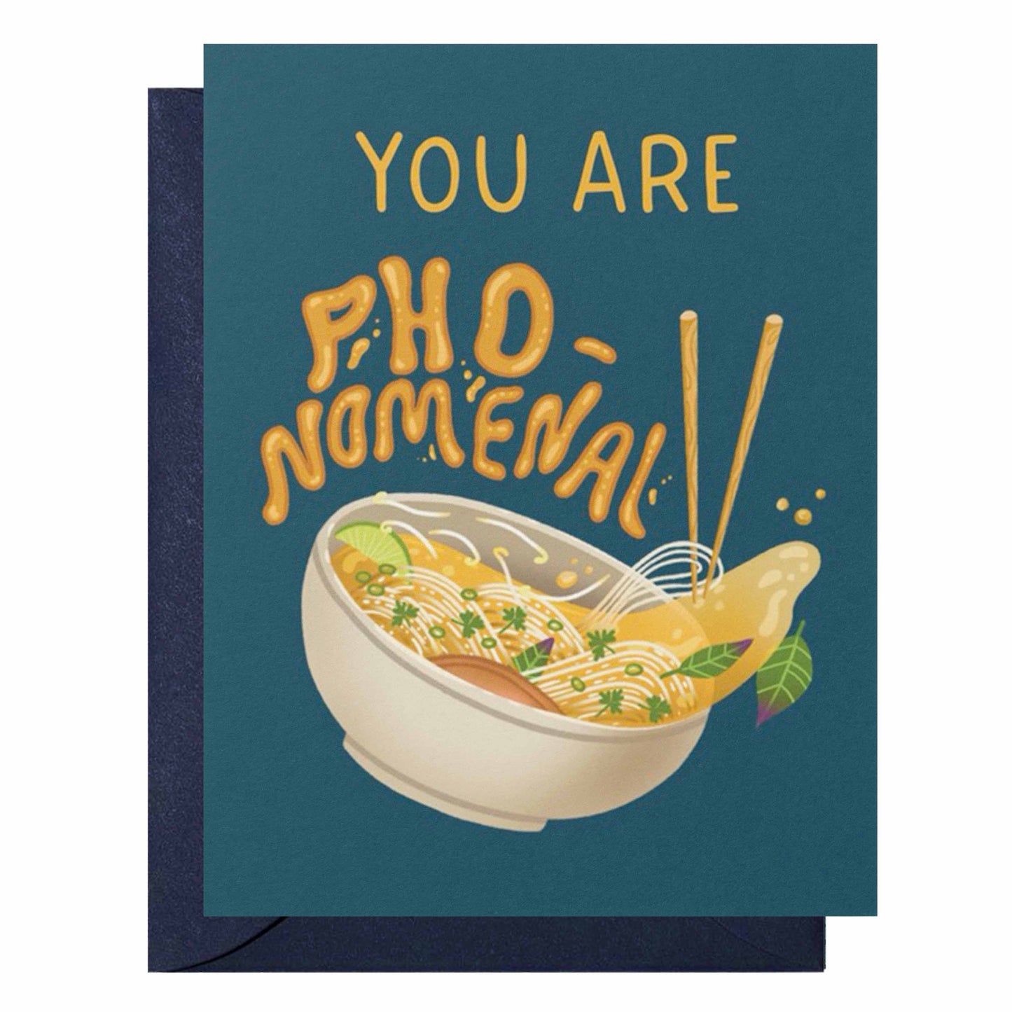 A greeting card with a dark teal background and a navy envelope. The card features the text 'YOU ARE PHO-NOMENAL' in a playful yellow-orange font above an illustration of a bowl of noodle soup with chopsticks.
