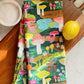 Colorful mushroom tea towel. Shown here on cutting board with a lemon and bowl of salt 
