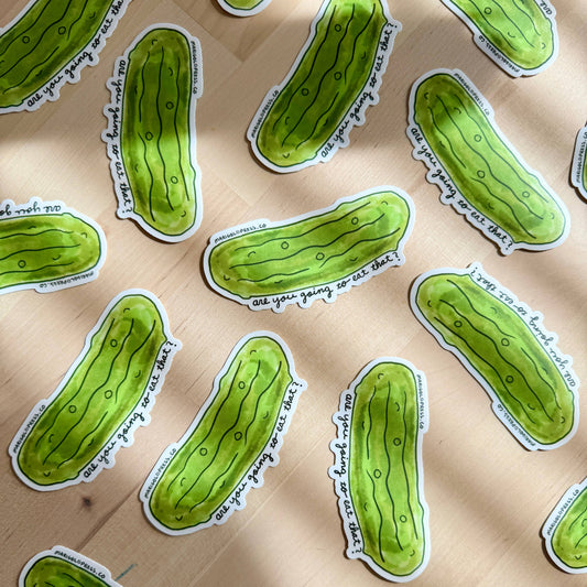 Green pickle-shaped stickers with text "are you going to eat that?" on a beige background
