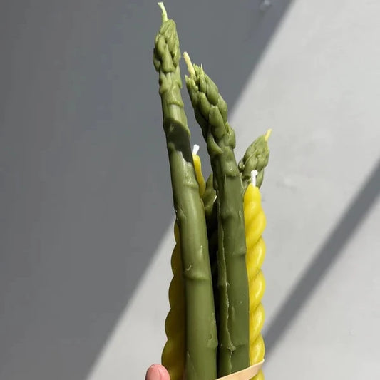 Green tapered candles that look like stalks of asparagus