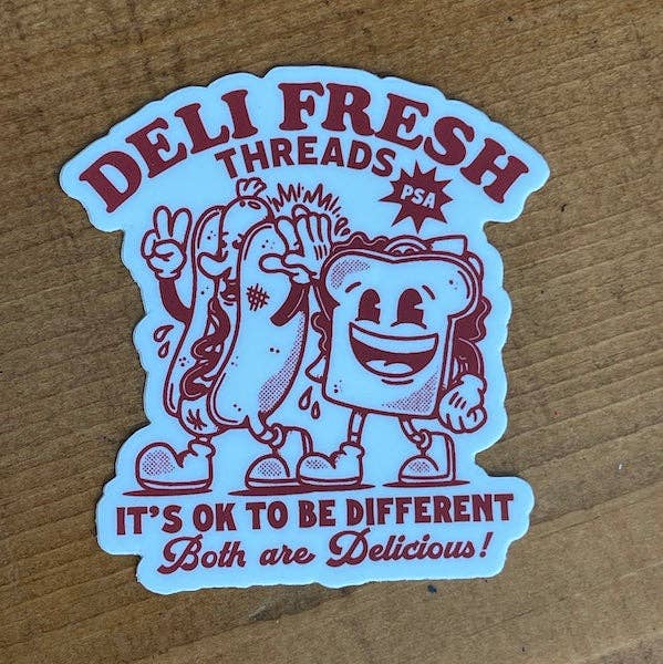 Sticker with cartoon hot dog and sandwich character on a wooden surface