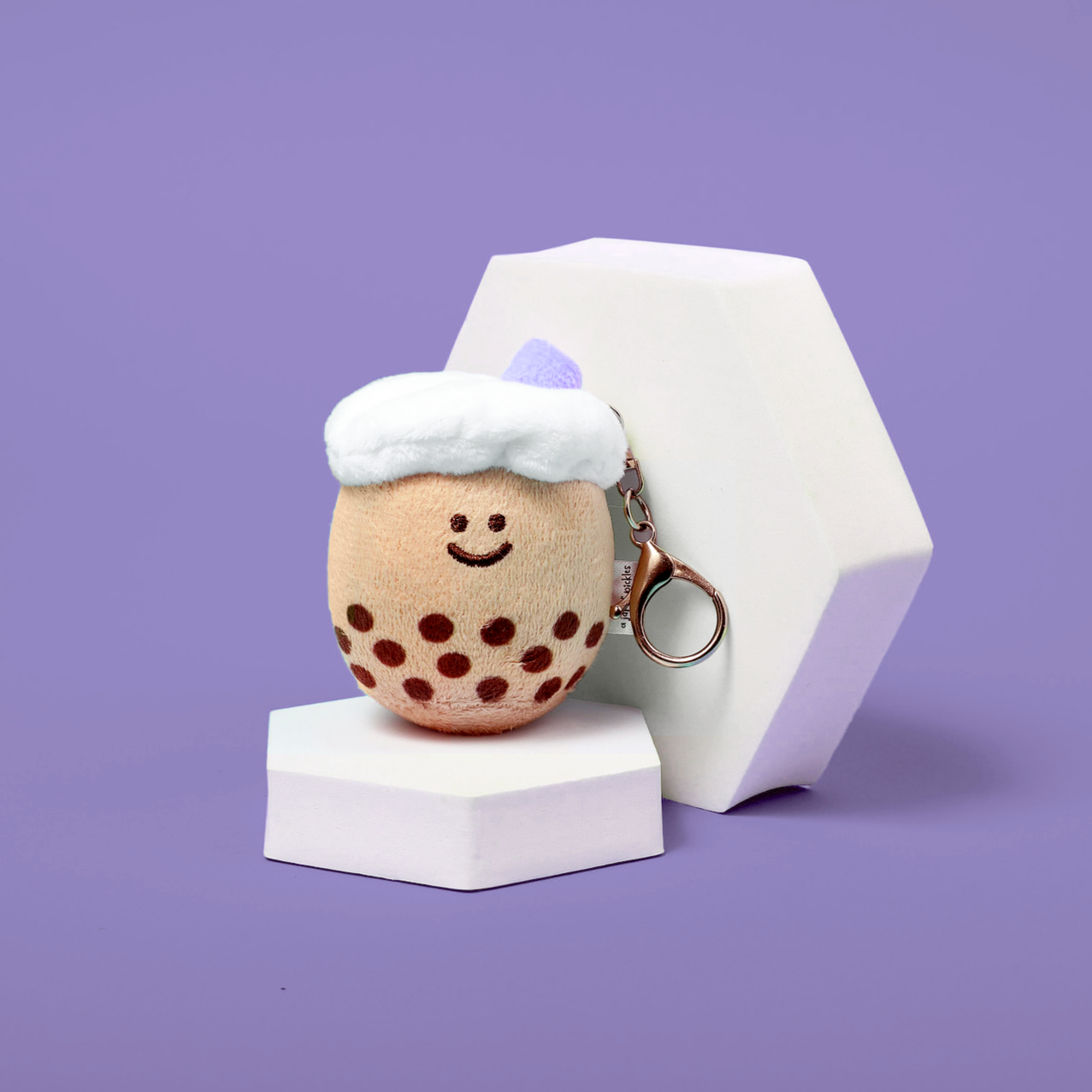 Boba plush keychain with a lilac colored straw