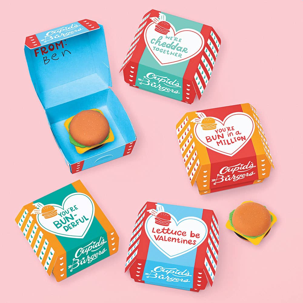 Colorful packaging boxes with burger eraser inside and Valentine's Day messages on a pink background