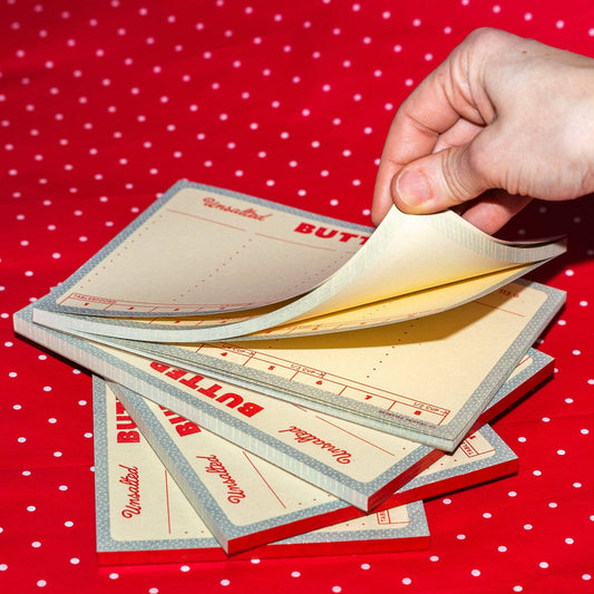 Large list style notepad designed to look like outer wrap on stick of butter