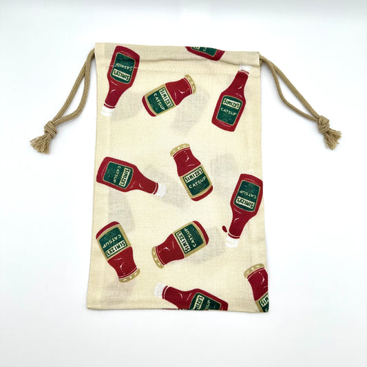 Drawstring pouch with assorted catsup bottles all over it.