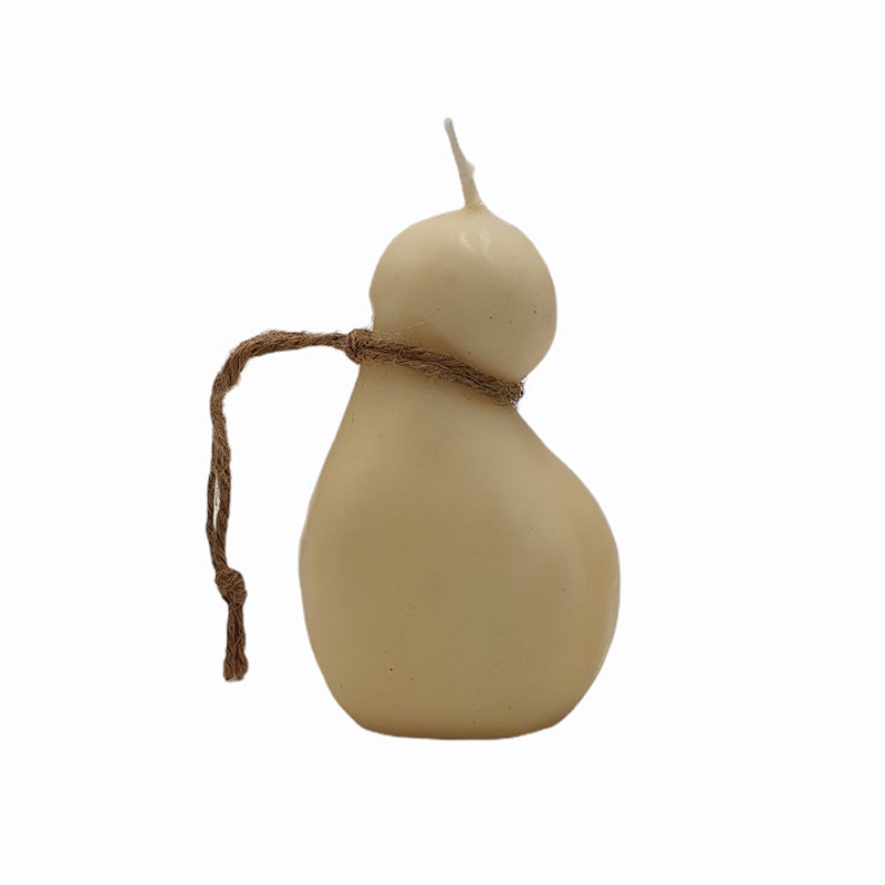 Candle shaped like Scamorza cheese -- white/cream in color and pear shaped with brown twine tied around skinniest part.