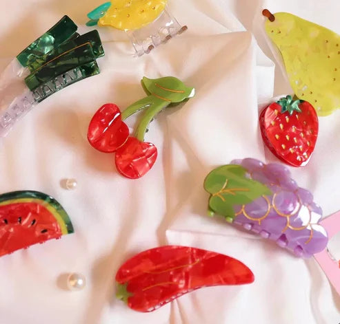 Chili pepper hair claw along with other fruits and veggie clips including, leeks, lemon, pear, strawbbery, grapes, watermelon and cherries